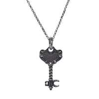 Pendente a forma di chiave con cuore